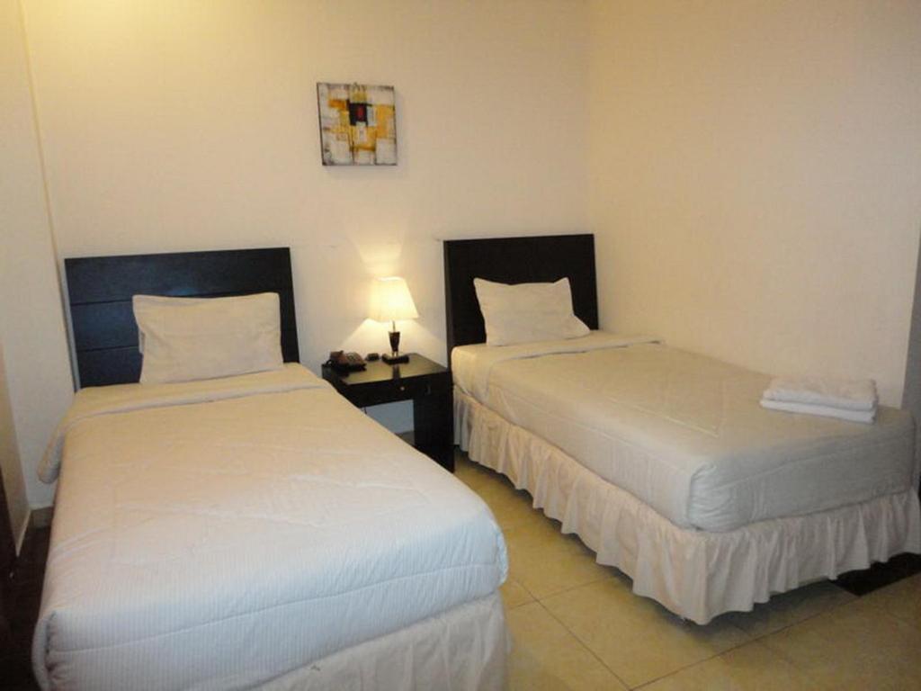 Grand Duta Hotel Palu Habitación foto